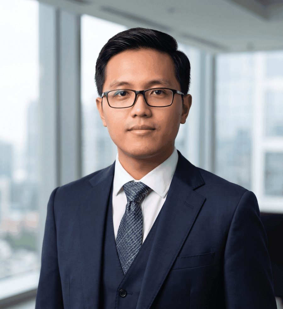 A clean, professional headshot of a corporate technology executive in a well-lit modern office setting.